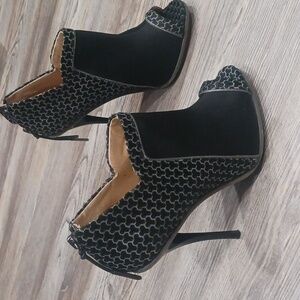 L.A.M.B. Wiatt Open-Toe Bootie in a Black and Blue Colorway. 